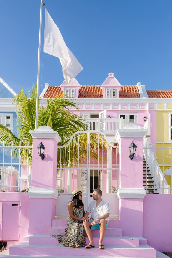 Couple in front of tropical building